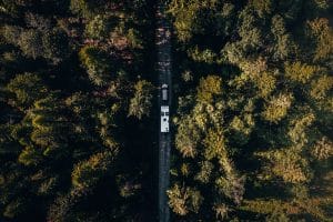 Drone Eye View of us Traveling Down a Dirt Road in Sandpoint, Idaho