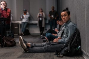 Attendee taking notes during a conference session