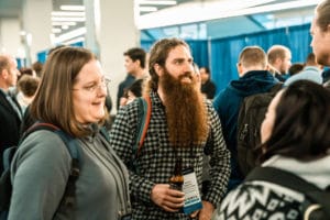 Attendees Socializing in between conference sessions in the expo hall