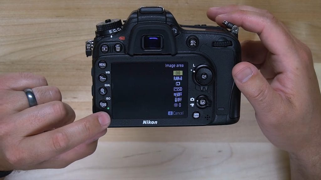 The i button on the back of the Nikon D7200